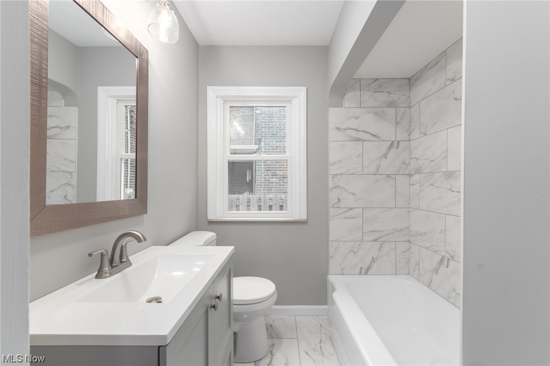 2410 Rinard Road Cleveland, OH 44118 - Photo 13 of 24 Full bathroom featuring toilet, tiled shower / bath combo, tile flooring, and oversized vanity