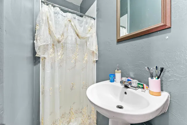 a bedroom with a bed and a table