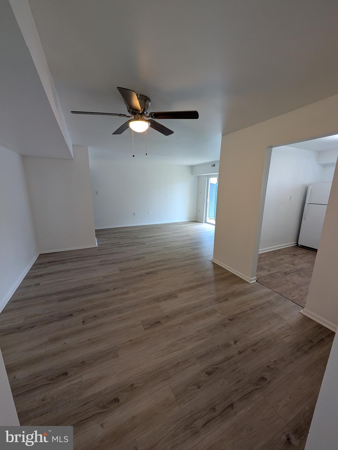 11402 Cherry Hill Road, Unit 103 Beltsville, MD 20705 - Photo 15 of 26 a view of a livingroom with wooden floor