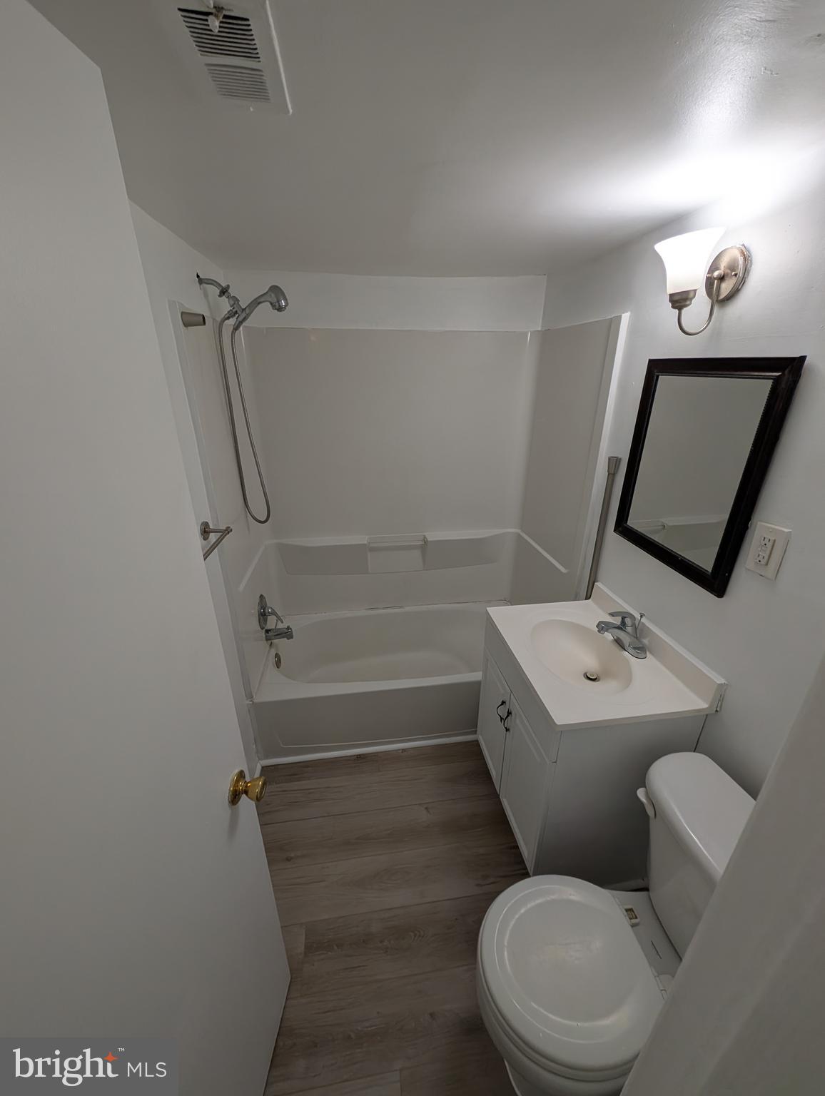 11402 Cherry Hill Road, Unit 103 Beltsville, MD 20705 - Photo 16 of 26 a bathroom with a toilet sink and mirror
