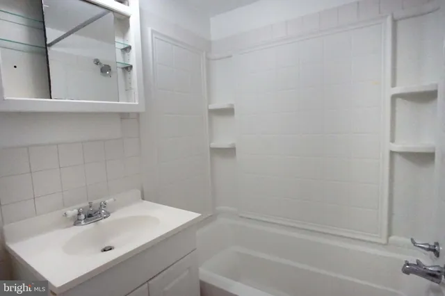 a bathroom with a sink and a bathtub