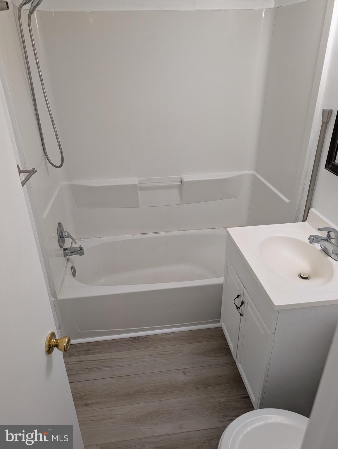 11402 Cherry Hill Road, Unit 103 Beltsville, MD 20705 - Photo 26 of 26 a bathroom with a sink a toilet and shower