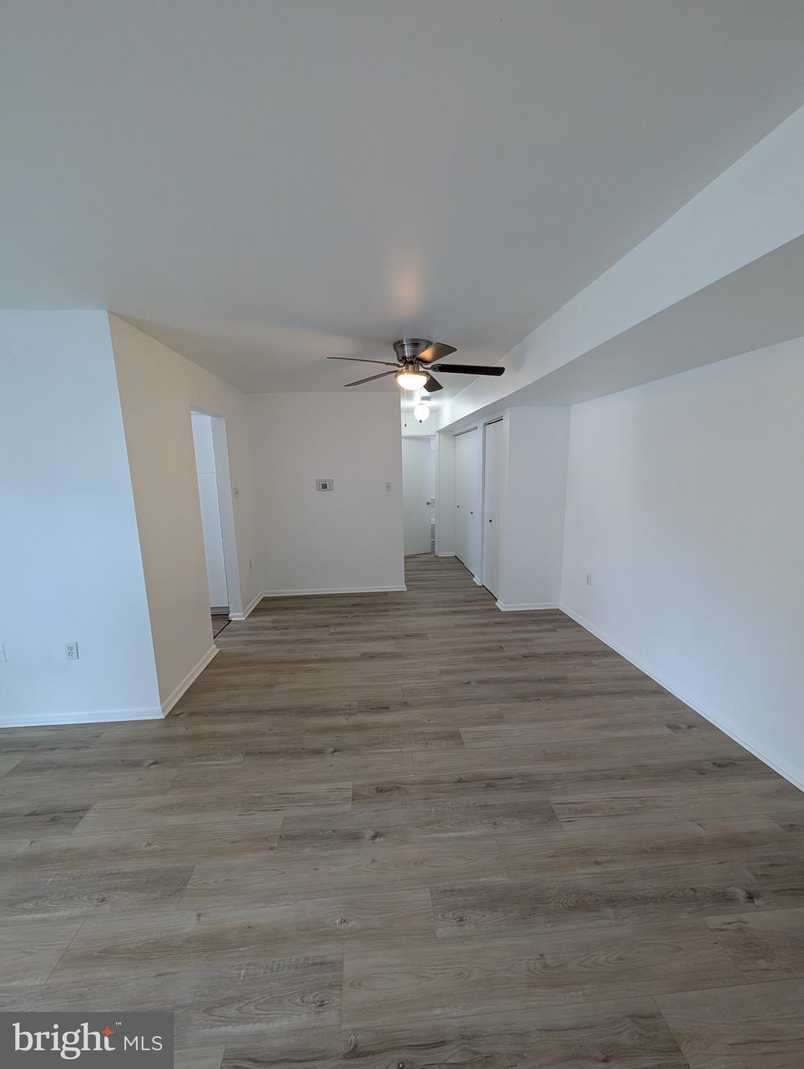 11402 Cherry Hill Road, Unit 103 Beltsville, MD 20705 - Photo 8 of 26 a view of empty room with wooden floor
