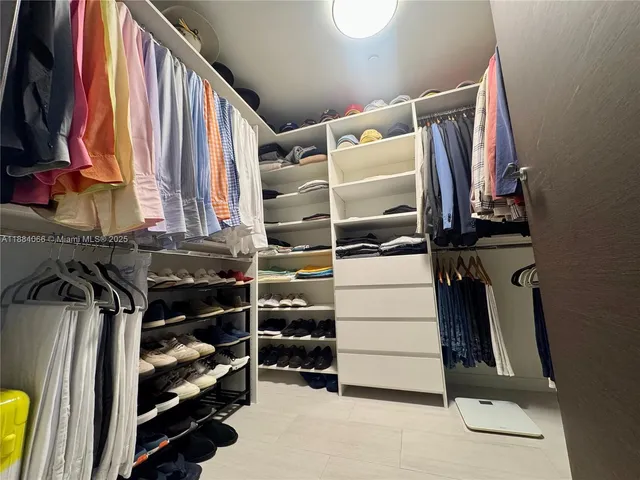 a bathroom with a sink double vanity granite toilet and shower