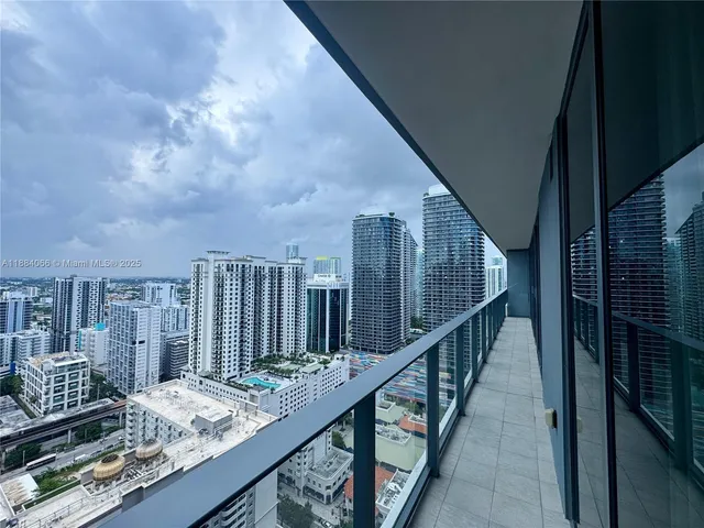 a view of balcony and wooden floor