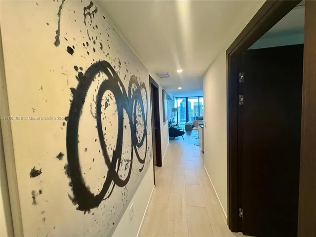 a view of gallery with wooden floor