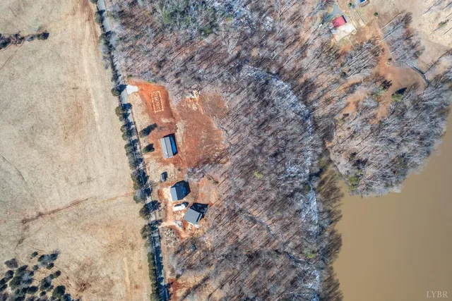a aerial view of a house with a yard