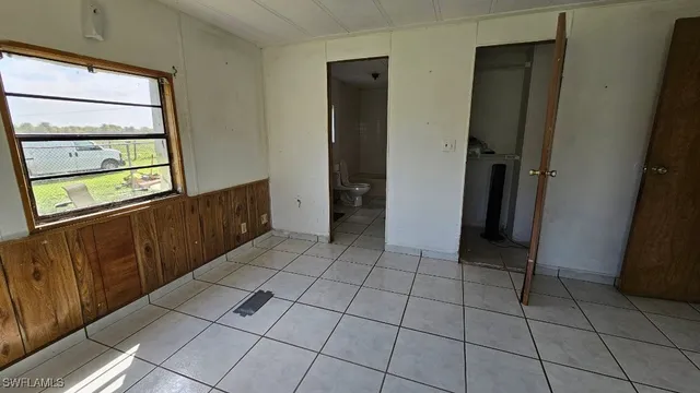 a view of a utility room with windows