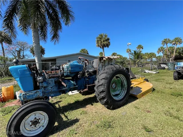 a view of a backyard with a patio and fire pit