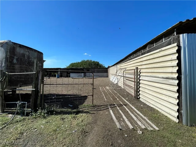 a view of swimming pool with a patio and fire pit