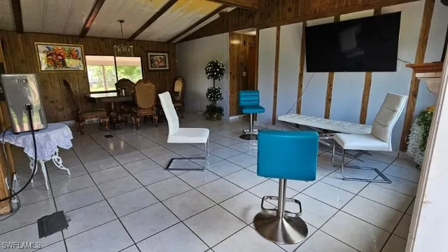 a dining room with furniture and a window