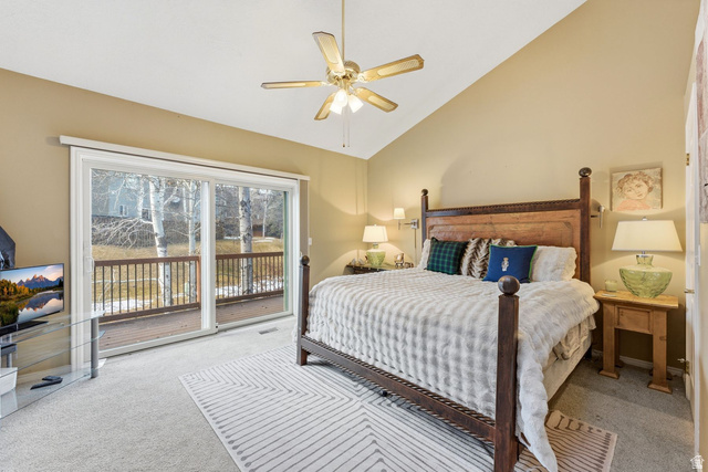 7930 Mustang Loop Road Park City, UT 84098 - Photo 8 of 23 Bedroom with access to exterior, light carpet, lofted ceiling, and a ceiling fan