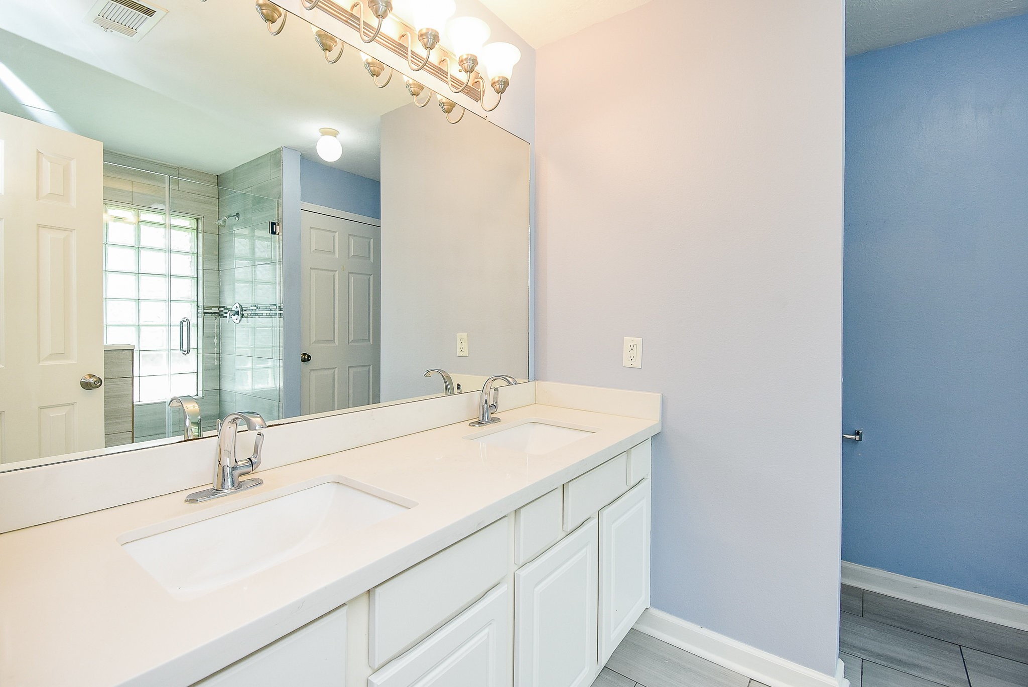 5431 Gosforth Drive Katy, TX 77449 - Photo 8 of 15 a bathroom with a sink and a mirror