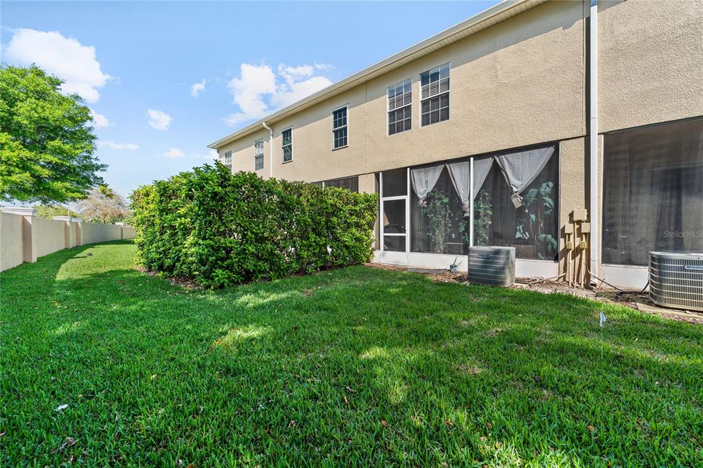 6039 Strada Isle Way Orlando, FL 32835 - Photo 11 of 24 a view of house with backyard and garden