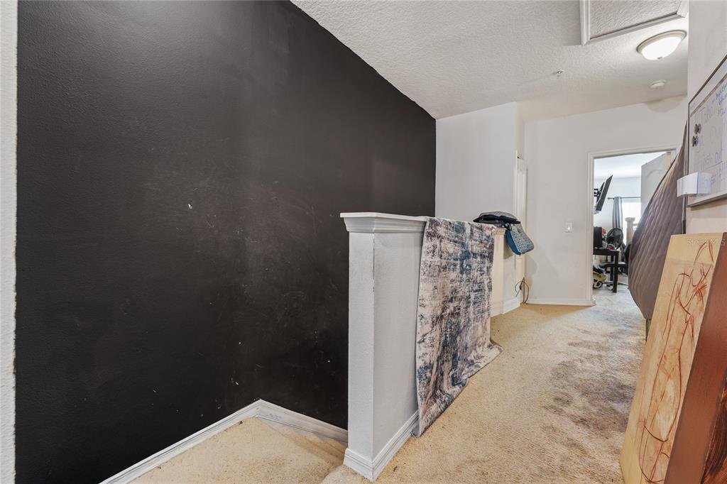 6039 Strada Isle Way Orlando, FL 32835 - Photo 13 of 24 a view of a livingroom with a pathway