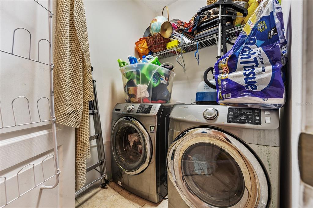 6039 Strada Isle Way Orlando, FL 32835 - Photo 19 of 24 a utility room with dryer and washer
