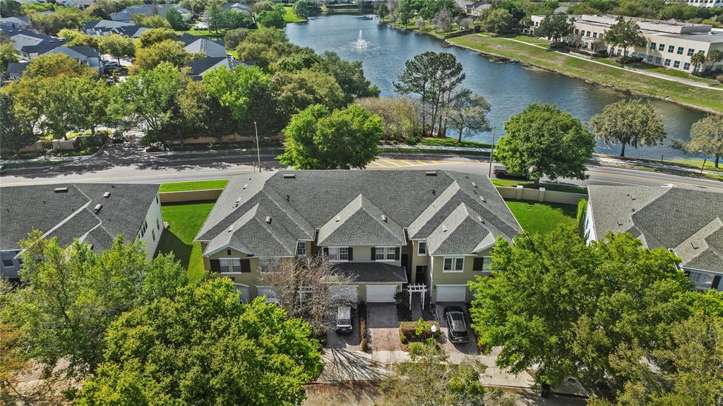 6039 Strada Isle Way Orlando, FL 32835 - Photo 20 of 24 an aerial view of a house with a lake view