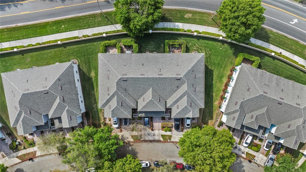 6039 Strada Isle Way Orlando, FL 32835 - Photo 21 of 24 an aerial view of a house with a garden and plants