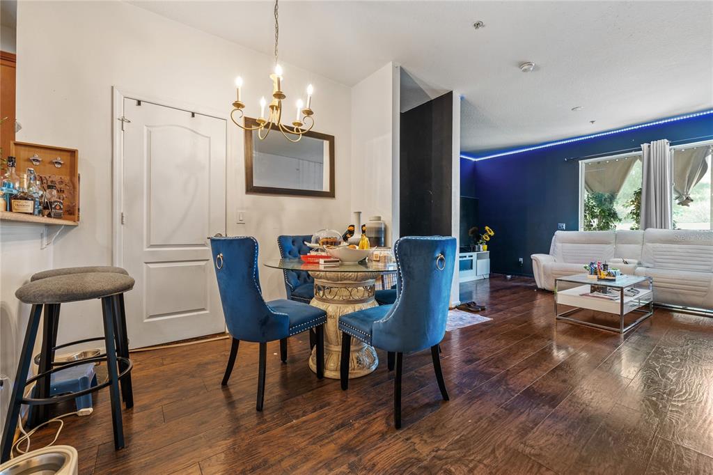 6039 Strada Isle Way Orlando, FL 32835 - Photo 5 of 24 a view of a dining room with furniture window and wooden floor
