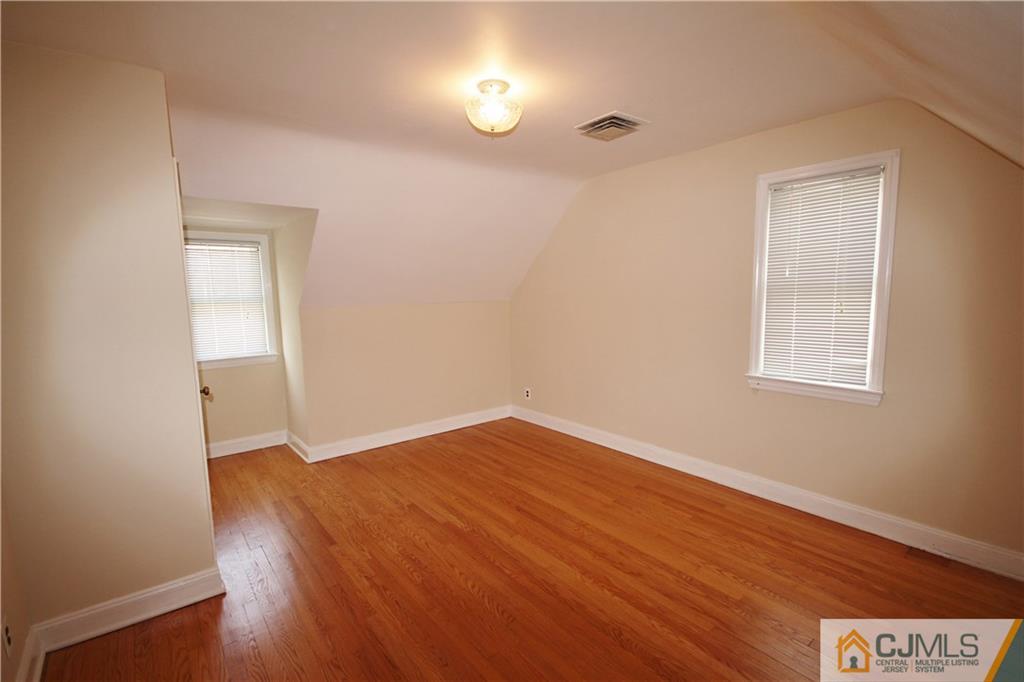 55 Milltown Road East Brunswick, NJ 08816 - Photo 11 of 18 a view of empty room with wooden floor and fan