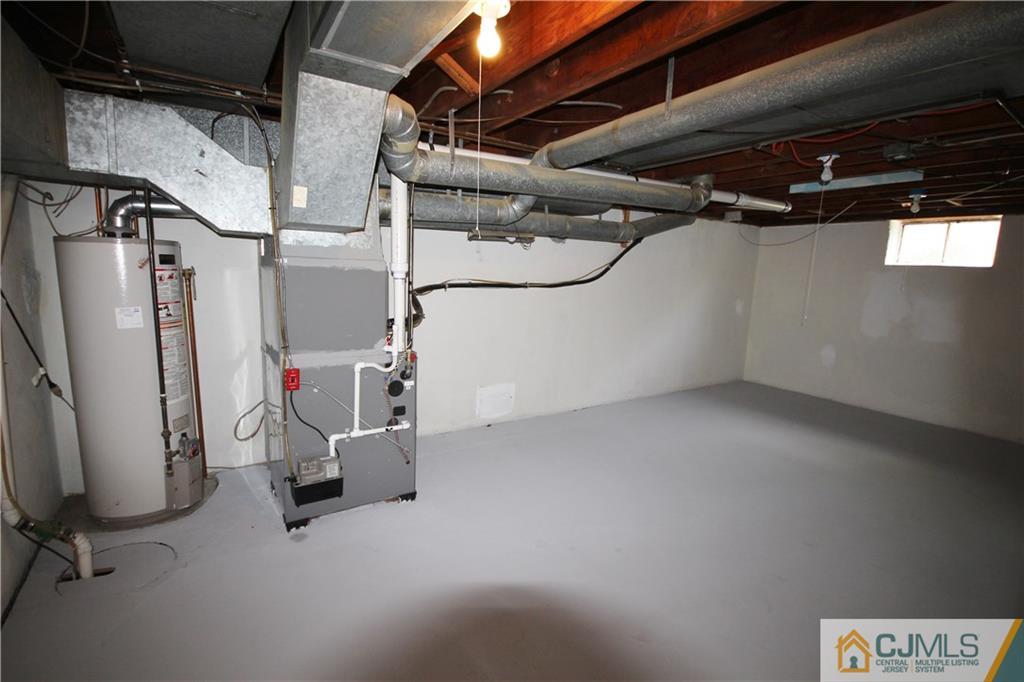 55 Milltown Road East Brunswick, NJ 08816 - Photo 13 of 18 a view of a storage room with stairs