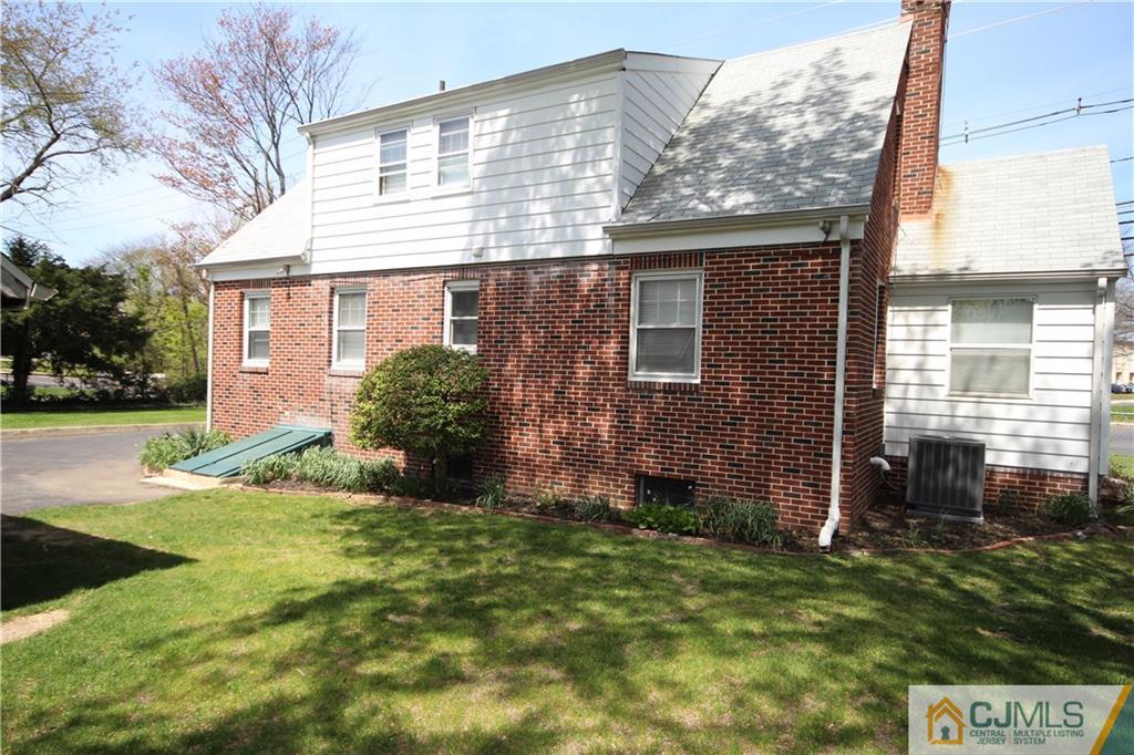 55 Milltown Road East Brunswick, NJ 08816 - Photo 15 of 18 a view of a house with a yard and plants