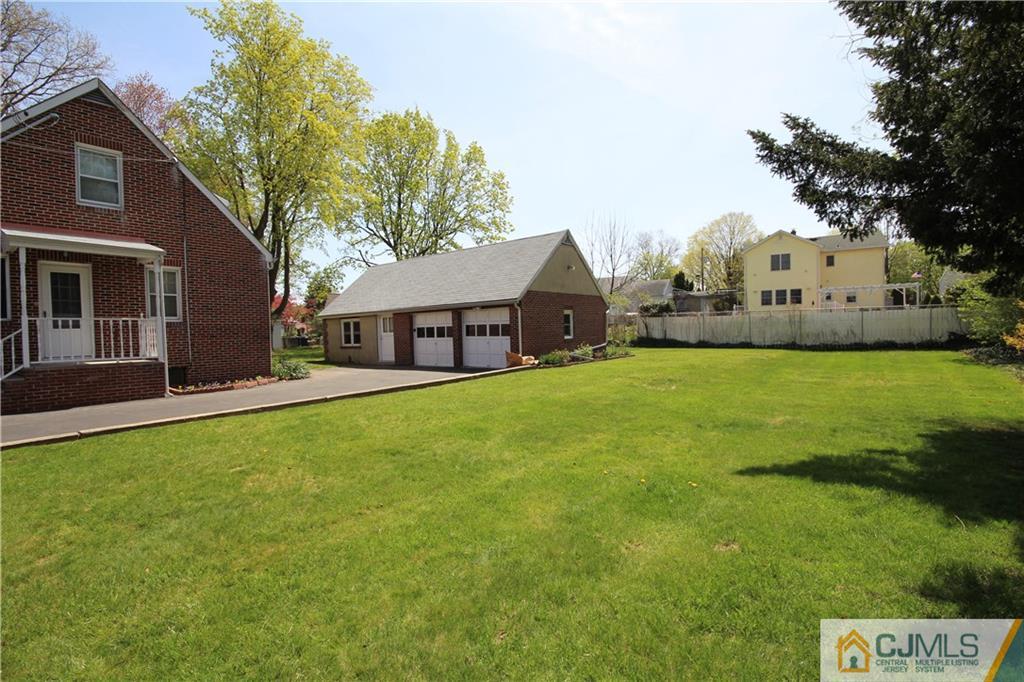 55 Milltown Road East Brunswick, NJ 08816 - Photo 17 of 18 a front view of a house with yard and green space