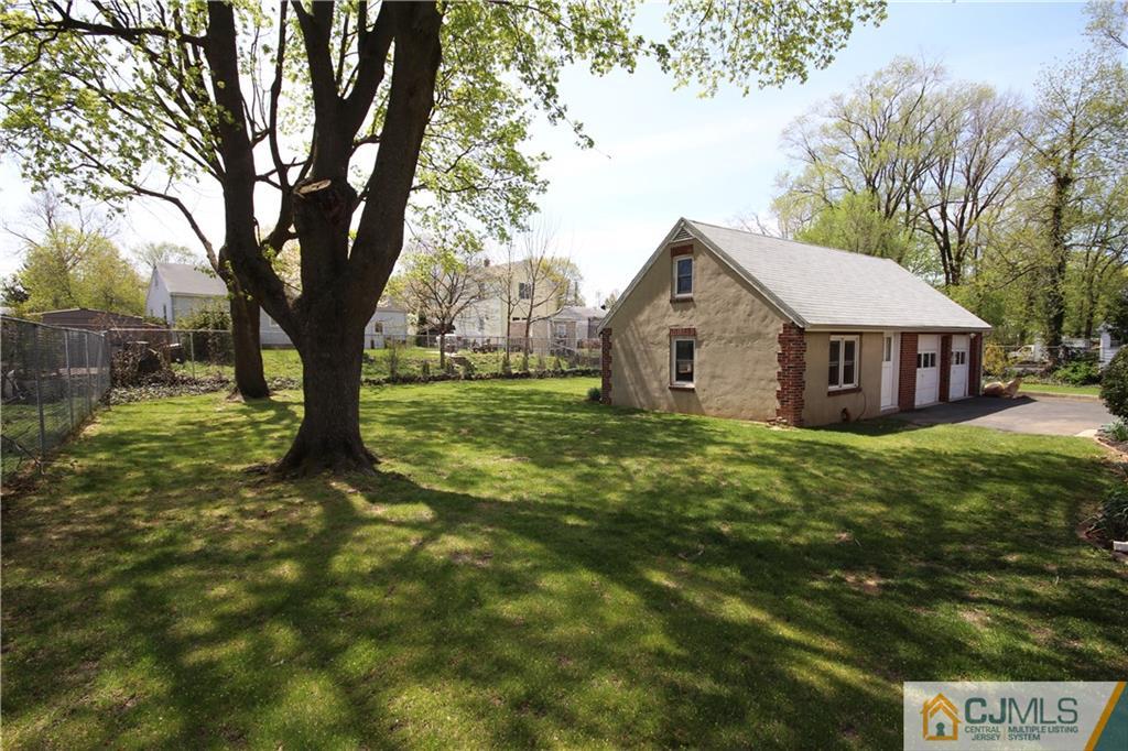 55 Milltown Road East Brunswick, NJ 08816 - Photo 18 of 18 a front view of a house with garden