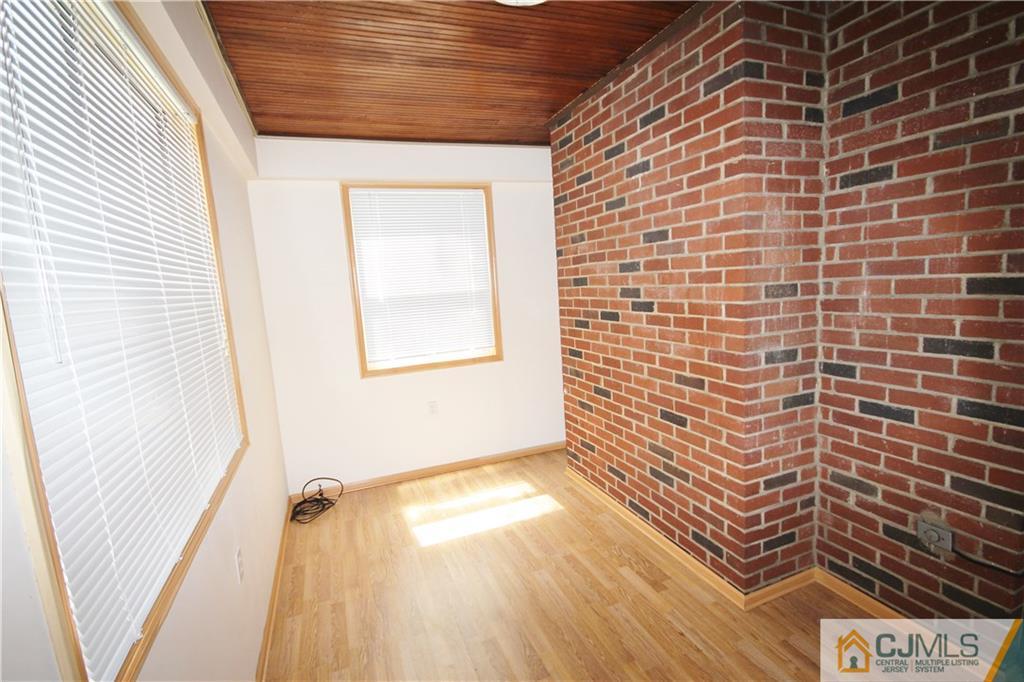 55 Milltown Road East Brunswick, NJ 08816 - Photo 3 of 18 a bathroom with a granite countertop window and a shower