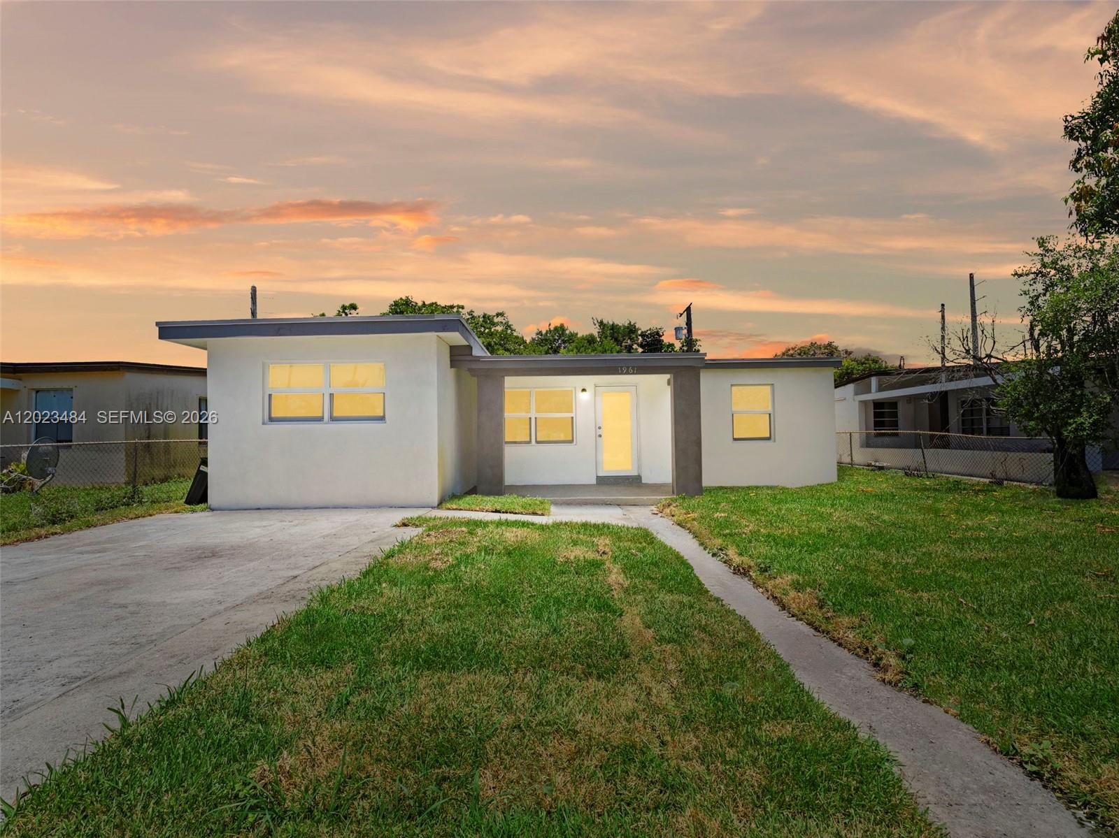 1961 Rutland Street Opa-Locka, FL 33054 - Photo 1 of 33 a view of a backyard of the house