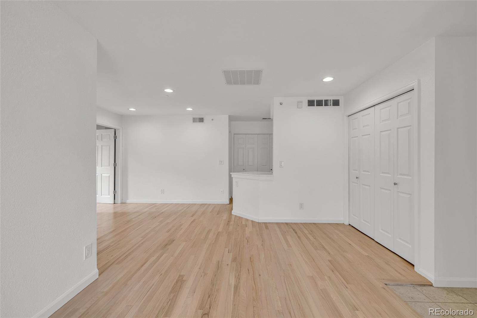 4870 Twin Lakes Road, Unit 1 Boulder, CO 80301 - Photo 20 of 26 a view of a big room with wooden floor and windows