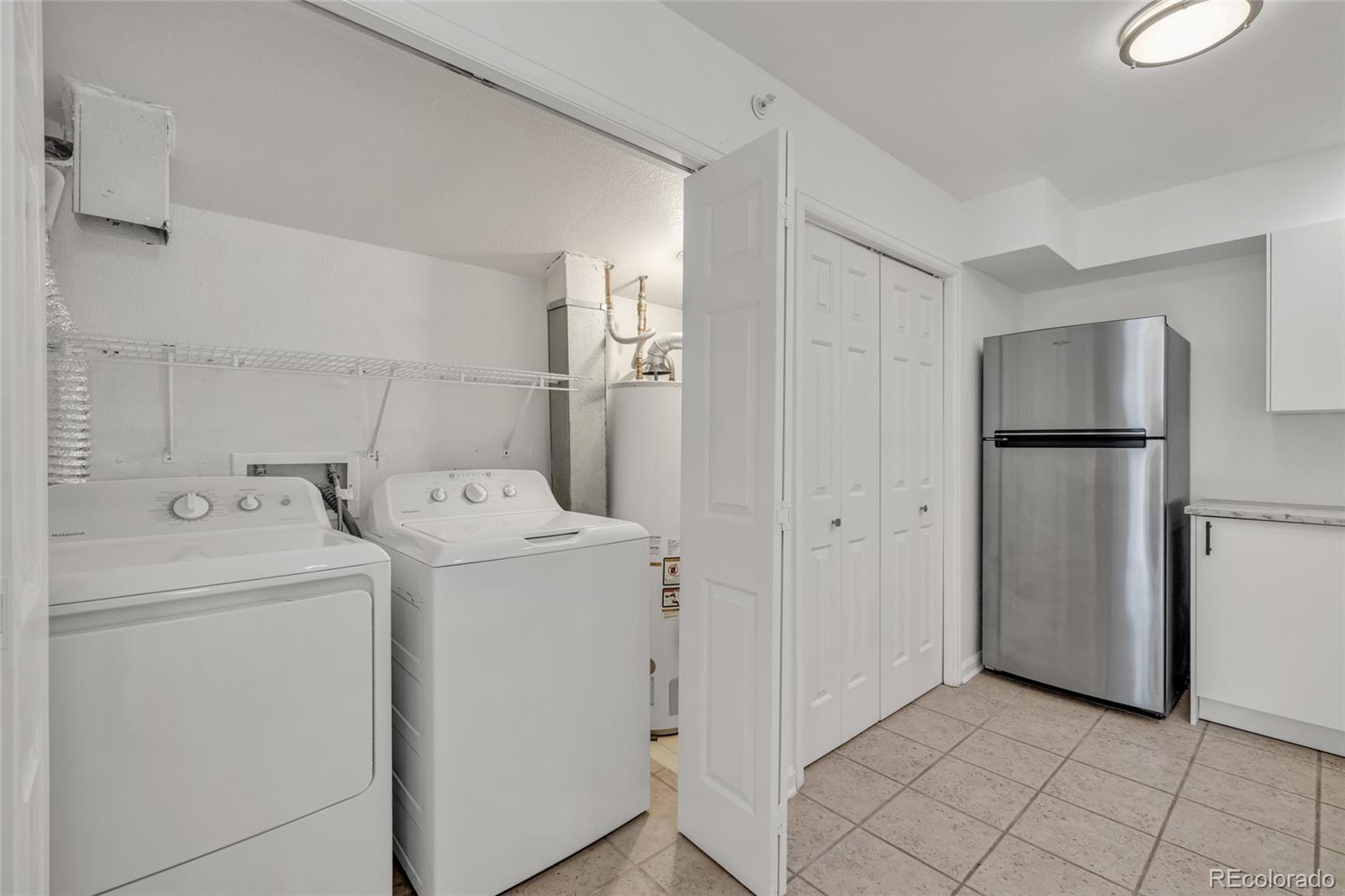 4870 Twin Lakes Road, Unit 1 Boulder, CO 80301 - Photo 21 of 26 a view of a storage & utility room with dryer and washer