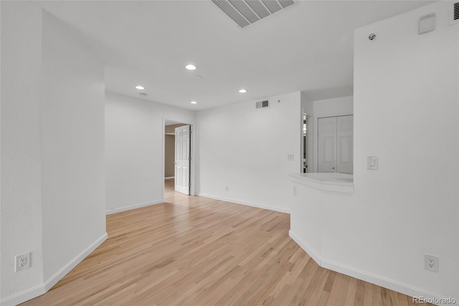 4870 Twin Lakes Road, Unit 1 Boulder, CO 80301 - Photo 8 of 26 a view of an empty room with wooden floor