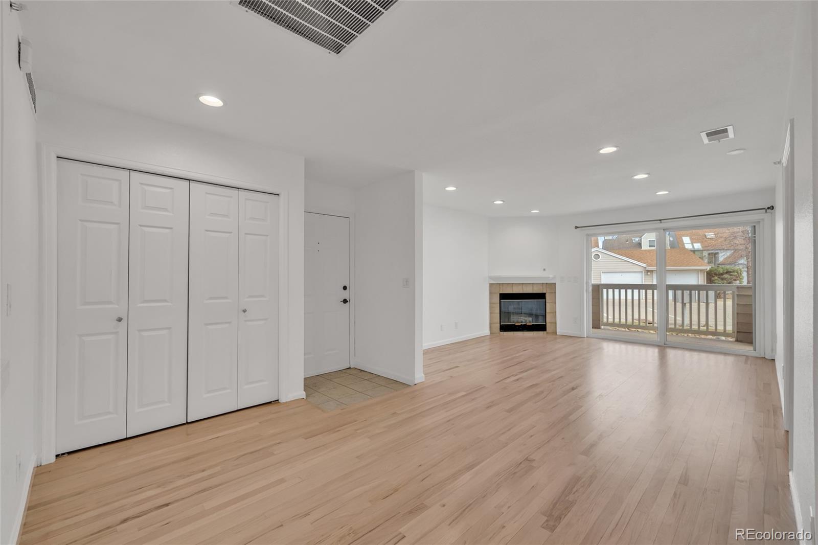 4870 Twin Lakes Road, Unit 1 Boulder, CO 80301 - Photo 10 of 26 a view of an empty room with wooden floor and a window