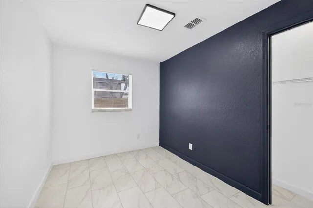 an empty room with a hallway