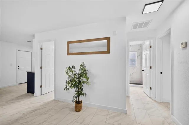 a view of an entryway with wooden floor