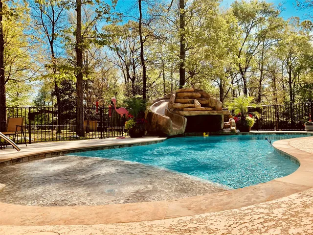 a view of a park with large trees