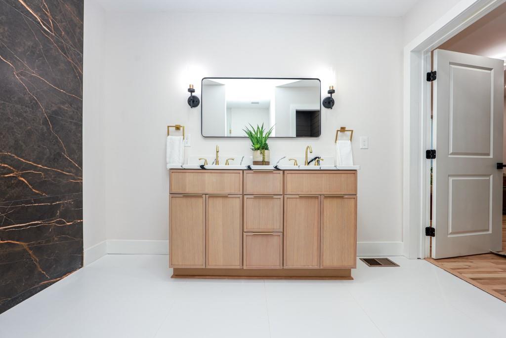 2566 Creekwood Terrace Decatur, GA 30030 - Photo 25 of 49 a bathroom with a sink and a mirror