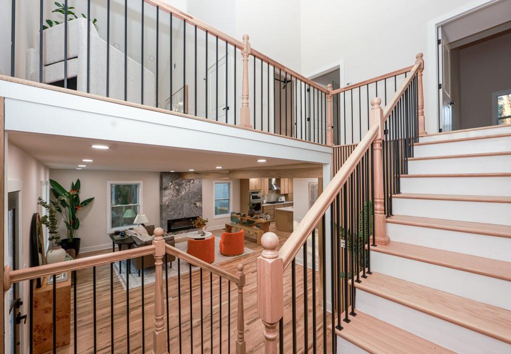 2566 Creekwood Terrace Decatur, GA 30030 - Photo 29 of 49 a view of staircase with lots of frames on wall and a large window