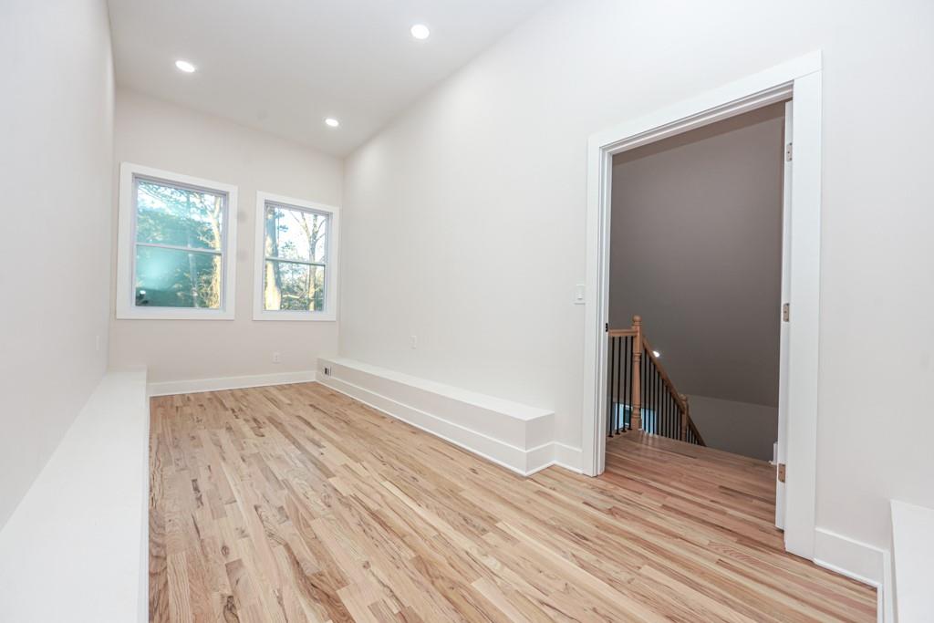 2566 Creekwood Terrace Decatur, GA 30030 - Photo 40 of 49 a view of an empty room with wooden floor and a window