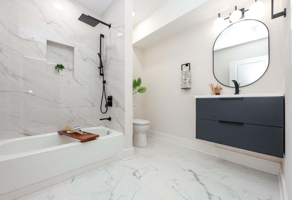 2566 Creekwood Terrace Decatur, GA 30030 - Photo 43 of 49 a bathroom with a sink a toilet and a mirror