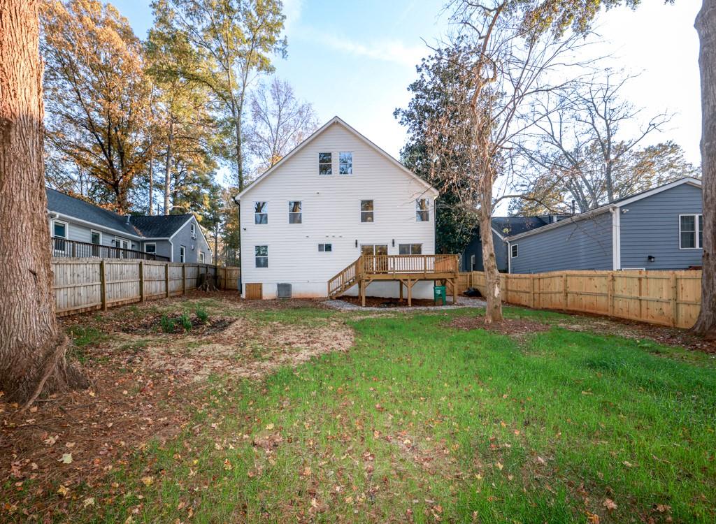 2566 Creekwood Terrace Decatur, GA 30030 - Photo 49 of 49 a view of backyard of house with wooden fence and large trees