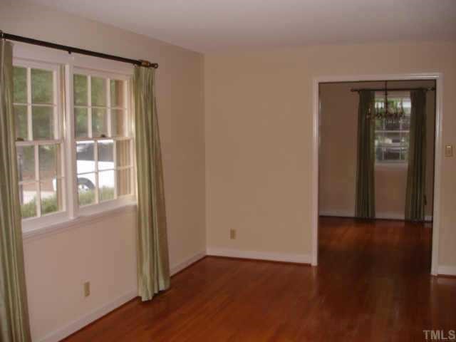 3919 Hope Valley Road Durham, NC 27707 - Photo 2 of 7 Spacious living room boasts of beautiful floors and lots of light