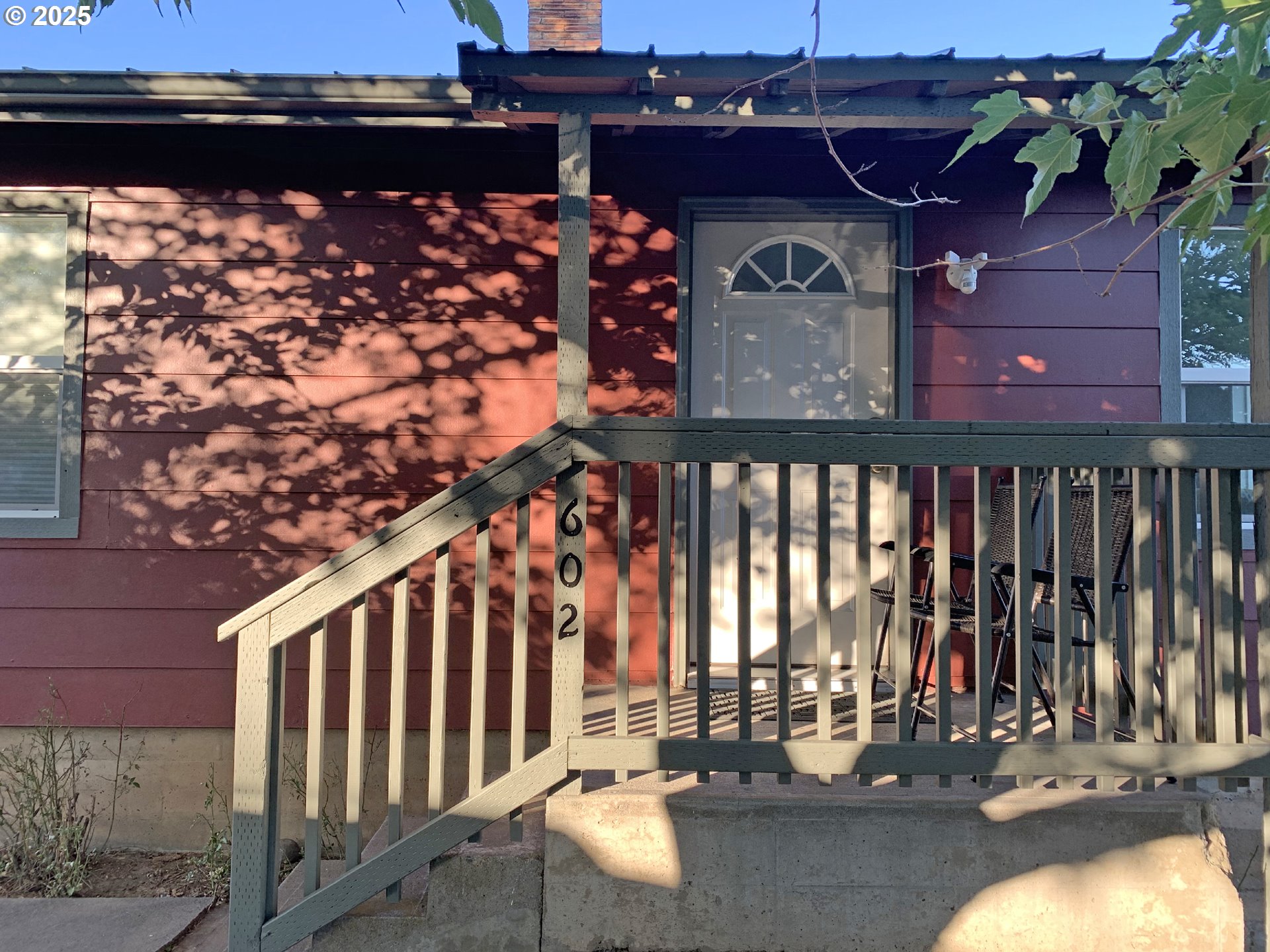 a front view of a house with parking area