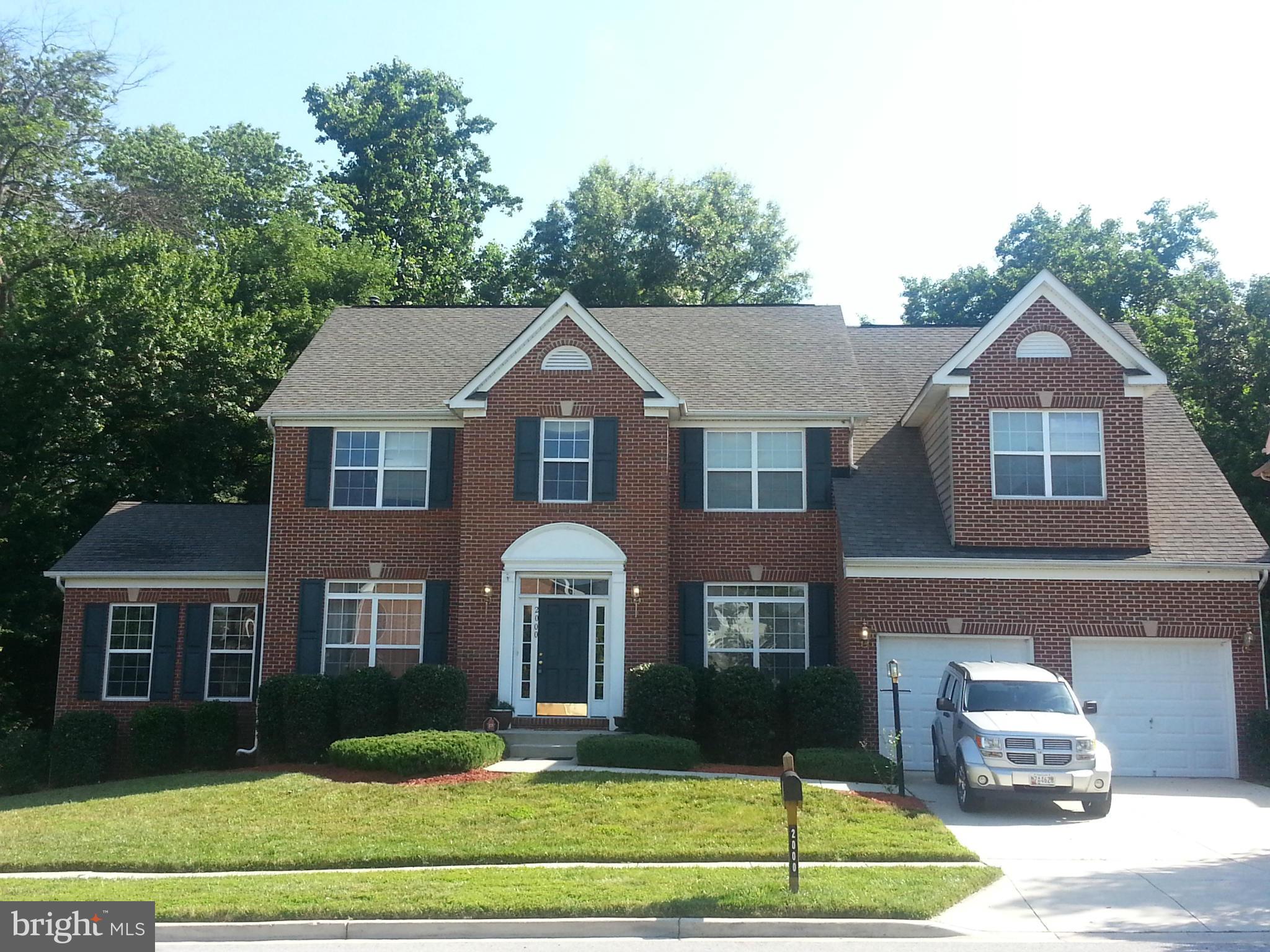 2000 Medinah Ridge Road Accokeek, MD 20607 - Photo 1 of 20 a front view of a house with garden
