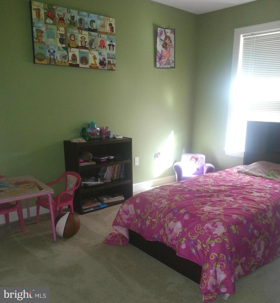 2000 Medinah Ridge Road Accokeek, MD 20607 - Photo 14 of 20 a bedroom with a bed and a chair