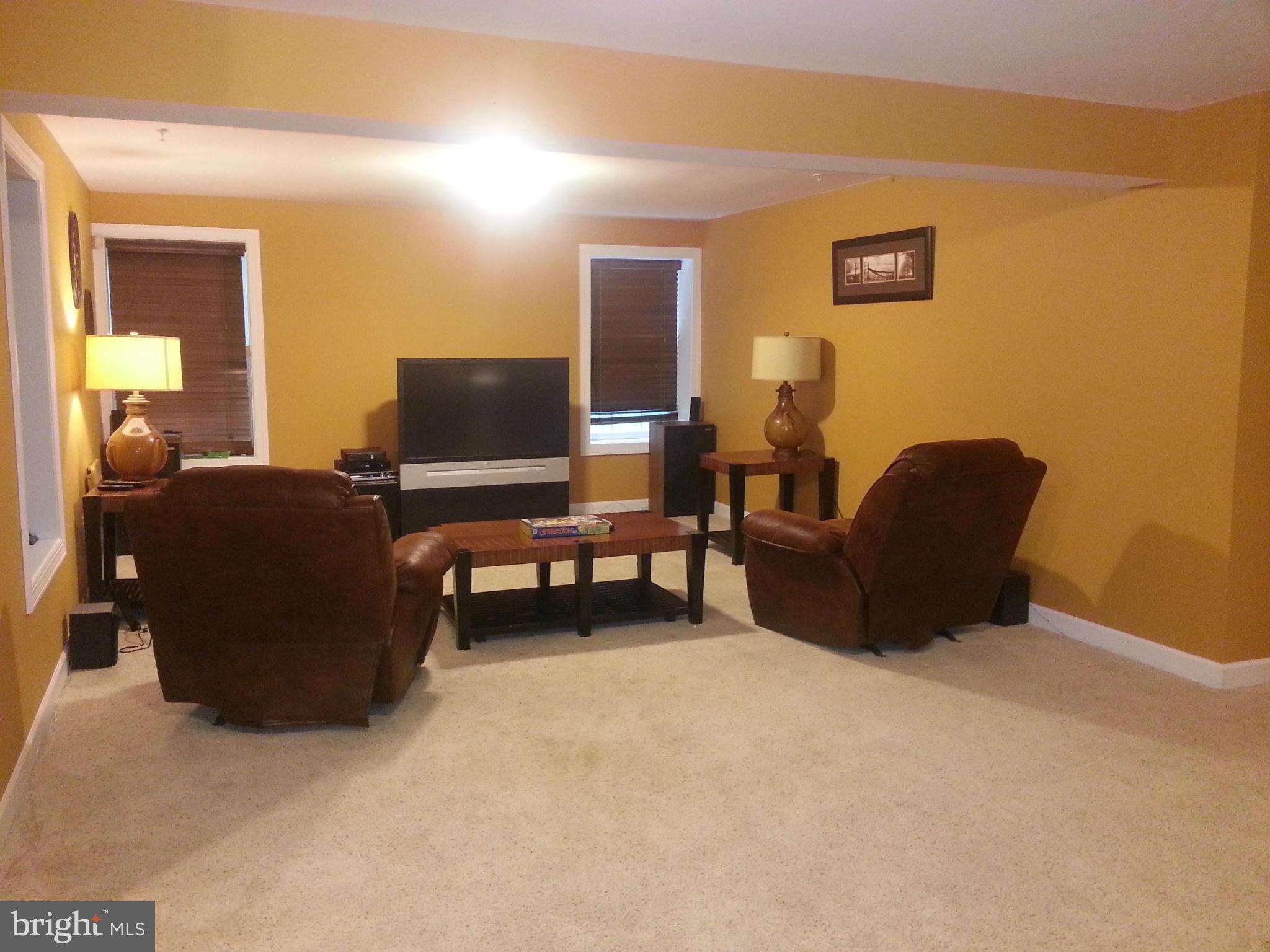 2000 Medinah Ridge Road Accokeek, MD 20607 - Photo 19 of 20 a living room with furniture and a flat screen tv