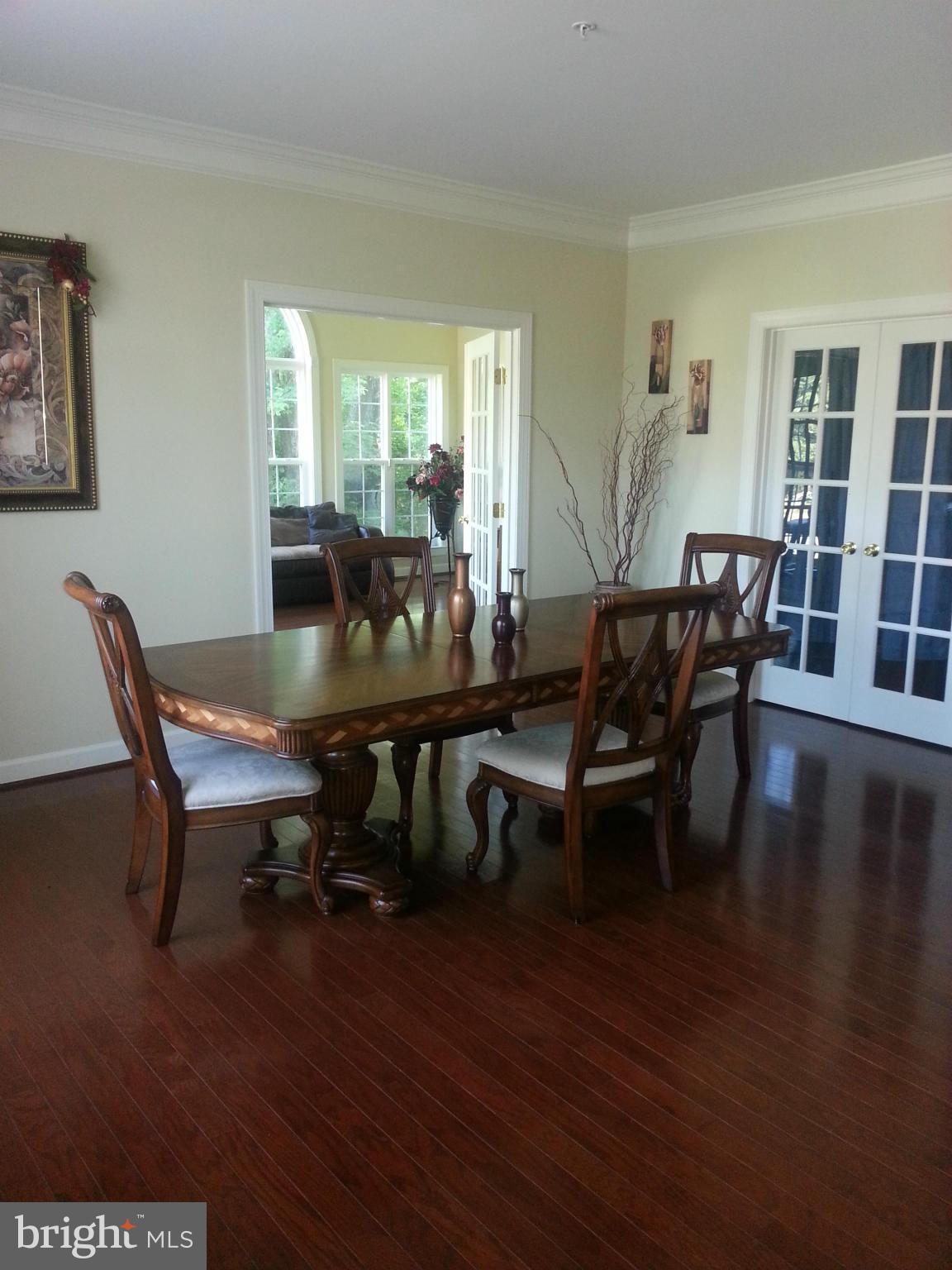 2000 Medinah Ridge Road Accokeek, MD 20607 - Photo 4 of 20 a view of a dining room with furniture window and wooden floor
