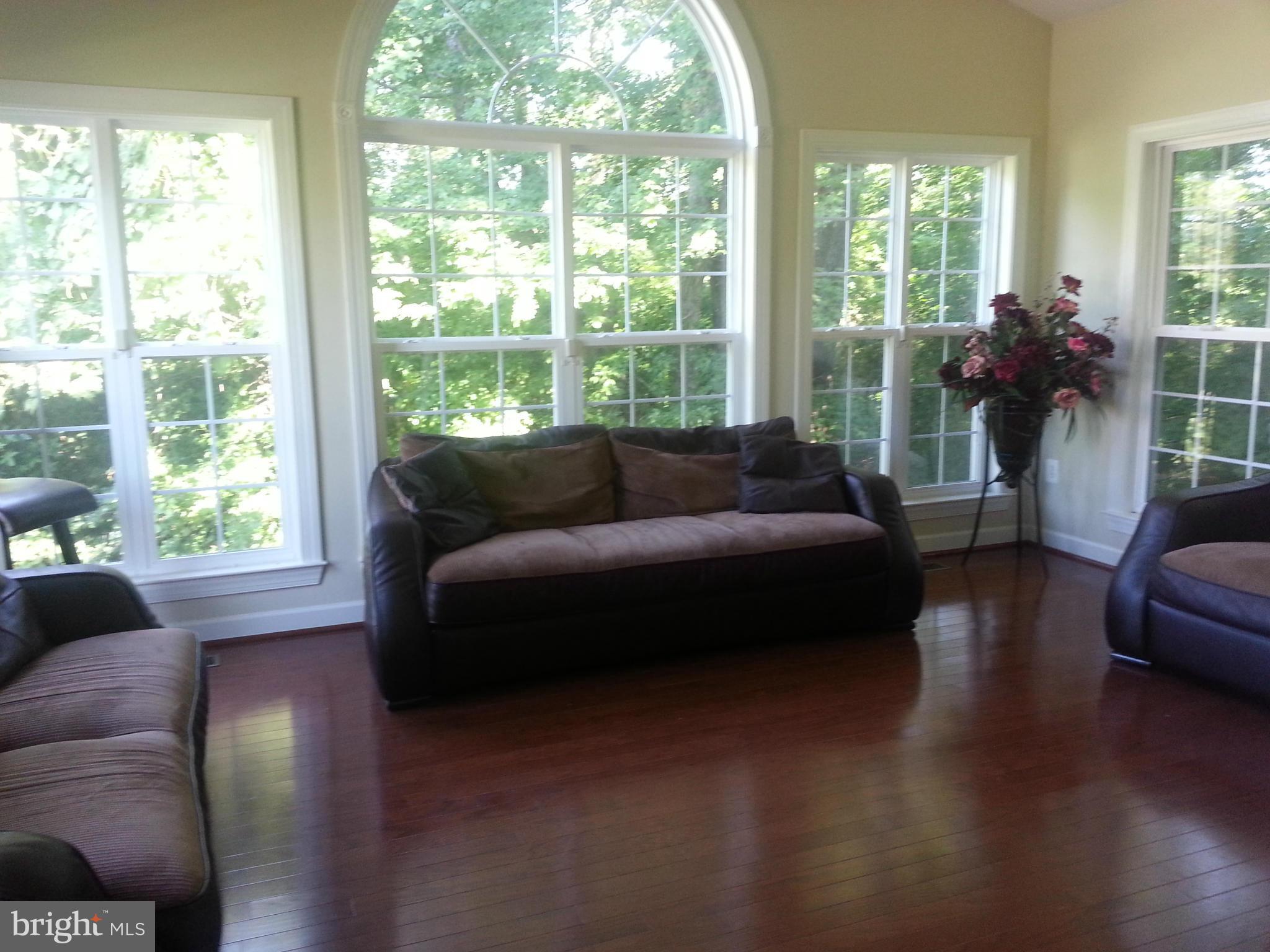 2000 Medinah Ridge Road Accokeek, MD 20607 - Photo 5 of 20 a living room with furniture and a large window