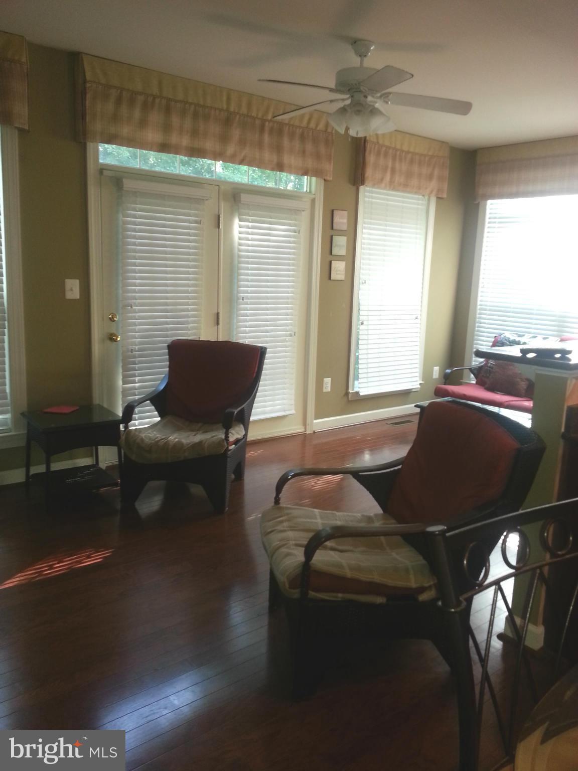 2000 Medinah Ridge Road Accokeek, MD 20607 - Photo 7 of 20 a living room with furniture and a lamp